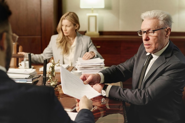 experienced attorneys working with documents sitting office 249974 19703